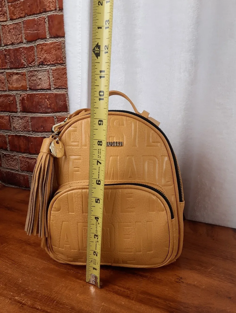 Steve Madden Mustard Mini Tassel Backpack